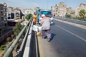 أعمال نظافة وتشجير بالحي
