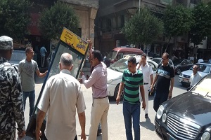 حملة لرفع الإشغالات بشوارع الحي