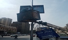 إزالة إعلانات مخالفة بشارع بورسعيد