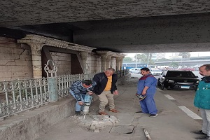 رفع قواعد خرسانية بشارع كورنيش النيل