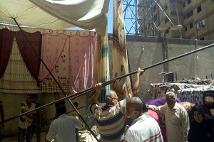 رفع الاشغالات من سوق الثلاثاء بحي المرج