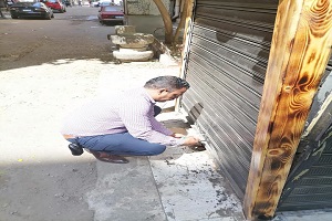 غلق كشك مخالف بشارع الشواربي