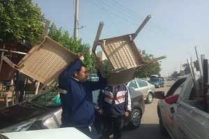 رفع الاشغالات من امام المحلات بشارع هارون الرشيد