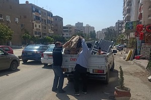 رفع اشغالات الباعة الجائلين وكافية بشارع الطاقة