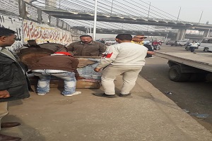 حملة لرفع الإشغالات من شوارع الحي