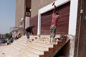 إزالة كاملة لسلم مخالف بعقار بعمارات التعاونيات