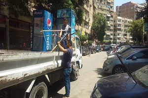    حملة لرفع اشغالات محل بعقار بشارع جسر السويس