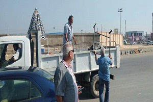 رفع الإشغالات بموقف العاشر القديم وشارع جسر السويس