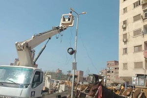 صيانة اعمدة الانارة بشارع محمد نجيب بحي المرج
