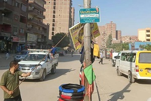 رفع إعلانات بدون ترخيص بشارع مؤسسة الزكاة