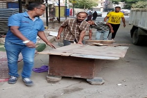 حملة لرفع الاشغالات ببعض الشوارع بالحي