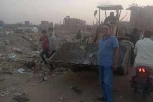 إزالة التعدى على أراضى زراعية بشارع ترعة عنانى