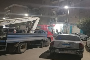 عمل إصلاح كابلات ارضية بشارع عباس العقاد