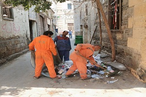 أعمال نظافة بالدرب الأحمر