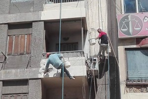 طلاء المبانى باللون الموحد بحي المطرية