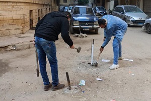حملة لرفع الحواجز الحديدية بشارع الفتح